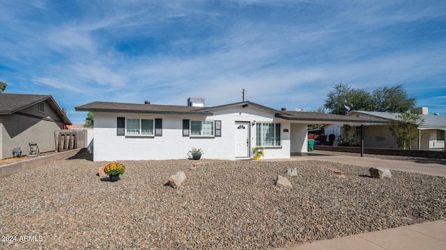 ranch-style house with a carport