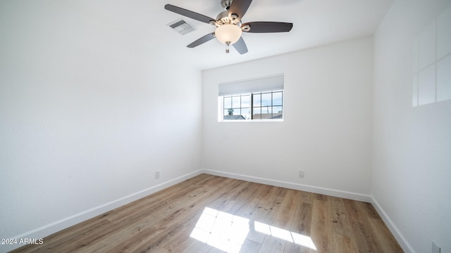 unfurnished room featuring ceiling fan and light hardwood / wood-style flooring