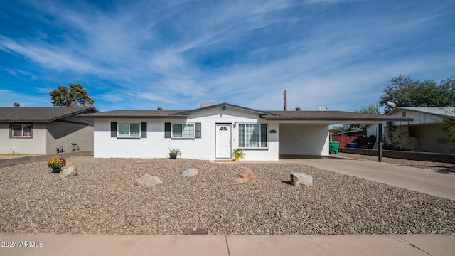 ranch-style home with a carport