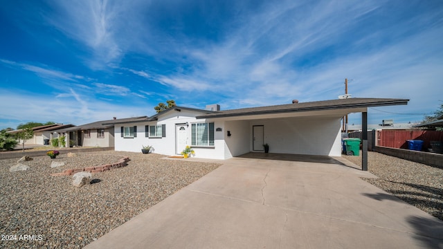 single story home with a carport