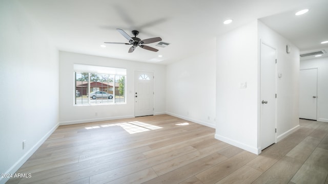 unfurnished room featuring ceiling fan and light hardwood / wood-style flooring