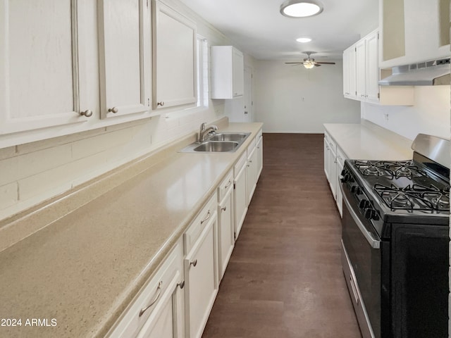 kitchen featuring sink, dark hardwood / wood-style flooring, gas stove, and white cabinetry