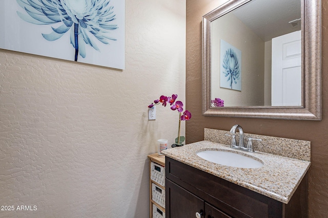 13318 W Indianola Ave, Litchfield Park, AZ 85340 - bathroom featuring a textured wall and vanity
