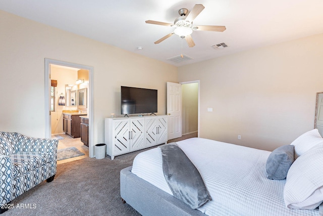 13318 W Indianola Ave, Litchfield Park, AZ 85340 - bedroom featuring light carpet, a ceiling fan, and connected bathroom