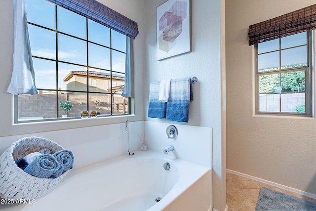 13318 W Indianola Ave, Litchfield Park, AZ 85340 - full bathroom featuring a bath, tile patterned floors, baseboards, and a textured wall