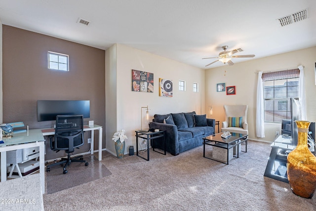 13318 W Indianola Ave, Litchfield Park, AZ 85340 - carpeted living area with a ceiling fan, an office area, and baseboards