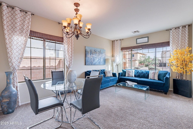 13318 W Indianola Ave, Litchfield Park, AZ 85340 - carpeted dining space with healthy amount of natural light and a chandelier