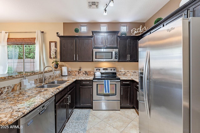 13318 W Indianola Ave, Litchfield Park, AZ 85340 - kitchen featuring stainless steel appliances, a sink, plenty of natural light, and light tile patterned floors