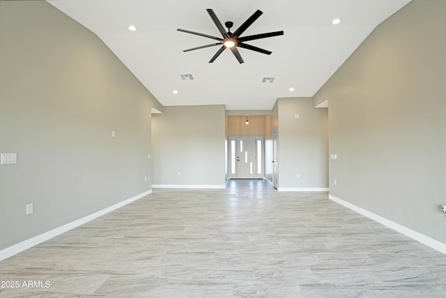 unfurnished living room with visible vents, baseboards, and ceiling fan