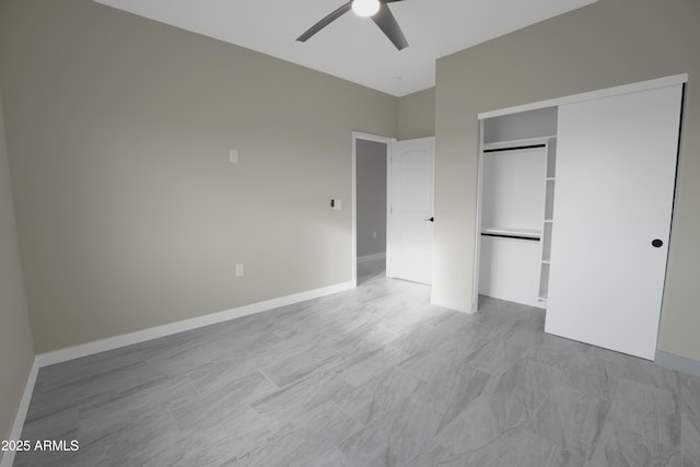 unfurnished bedroom with a ceiling fan, baseboards, and a closet