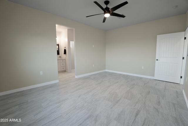 unfurnished room featuring baseboards and a ceiling fan