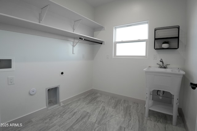 washroom featuring laundry area, hookup for a gas dryer, and baseboards