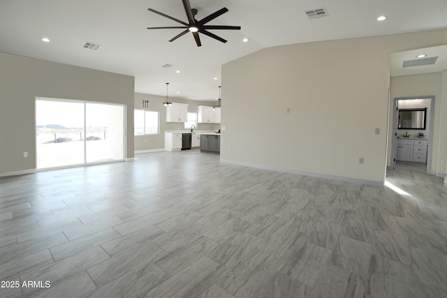 unfurnished living room with lofted ceiling, baseboards, visible vents, and ceiling fan