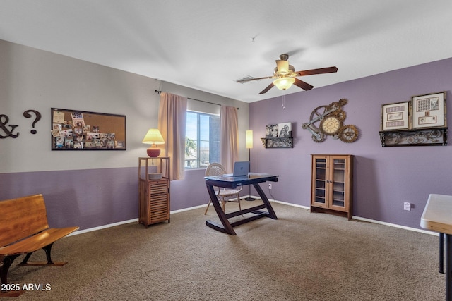 carpeted home office with ceiling fan