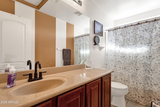 bathroom featuring a shower with shower curtain, vanity, toilet, and tile patterned flooring