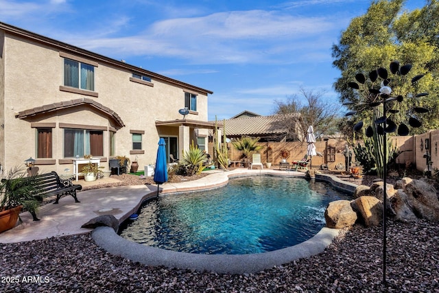 view of swimming pool featuring a patio area