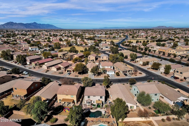 birds eye view of property featuring a mountain view