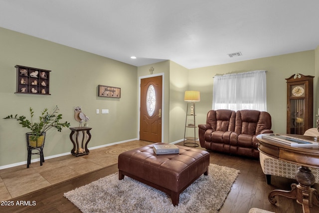 living room with hardwood / wood-style floors and a wealth of natural light