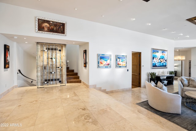 interior space with an inviting chandelier and light tile floors