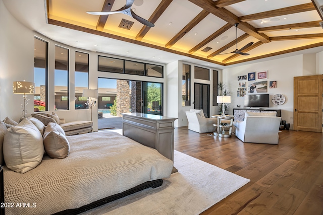 bedroom with beam ceiling, high vaulted ceiling, ceiling fan, and dark hardwood / wood-style flooring