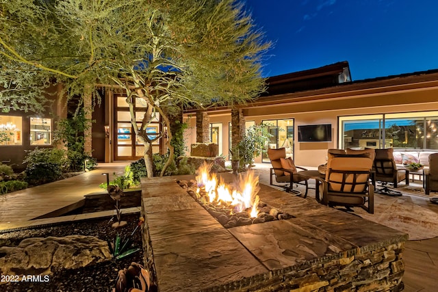 patio terrace at twilight with a fire pit