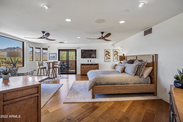 bedroom with light hardwood / wood-style flooring and ceiling fan