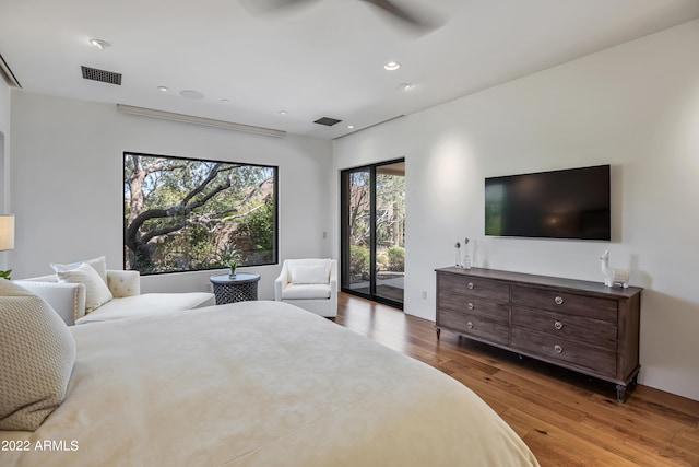 bedroom featuring ceiling fan, access to exterior, and light hardwood / wood-style floors