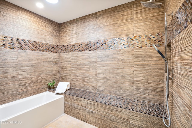 bathroom featuring tile walls and tile floors