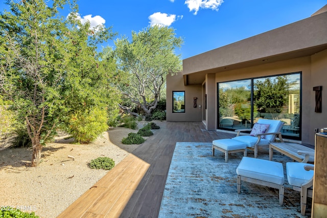 wooden deck with a patio area