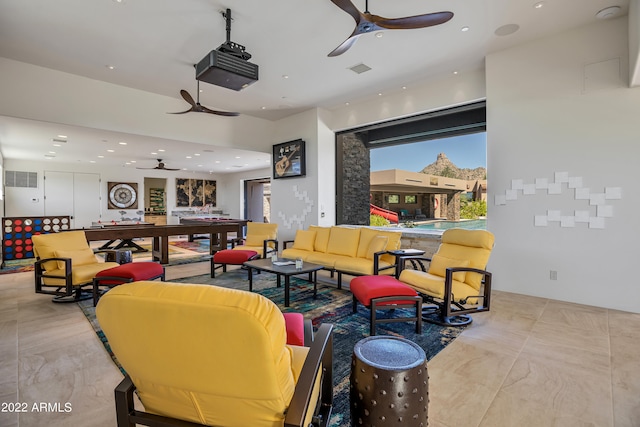 interior space with ceiling fan and light tile floors