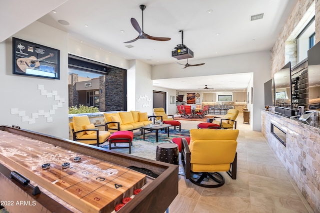 tiled living room with ceiling fan