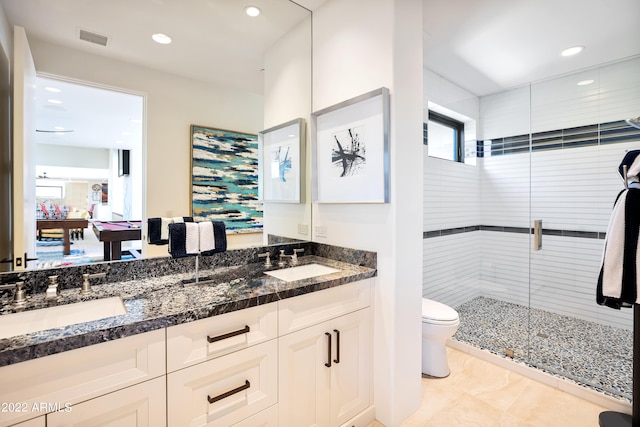 bathroom featuring billiards, walk in shower, toilet, dual bowl vanity, and tile floors