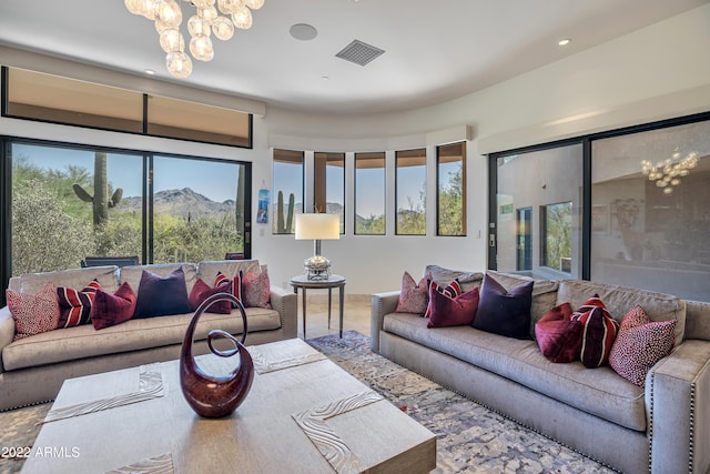 living room featuring a wealth of natural light and a chandelier