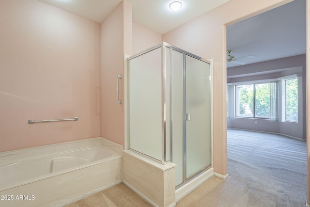 bathroom with plus walk in shower and ceiling fan