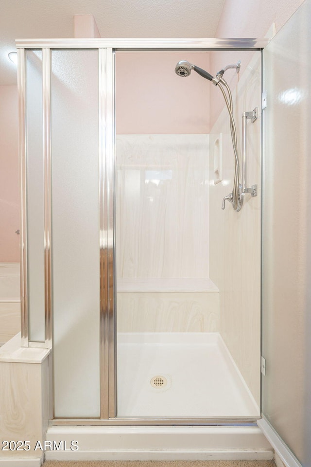 bathroom featuring an enclosed shower