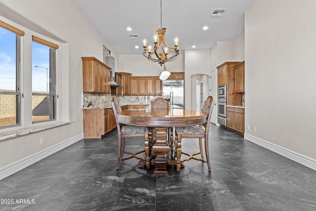 dining area featuring a notable chandelier