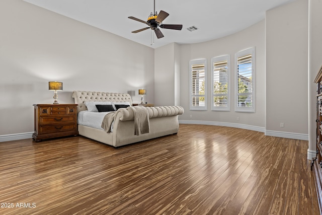 bedroom with hardwood / wood-style flooring and ceiling fan