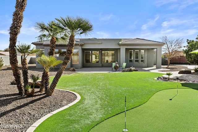 rear view of property with a patio area