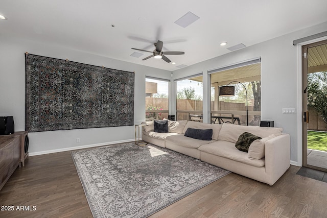living area with dark wood finished floors, recessed lighting, baseboards, and a ceiling fan