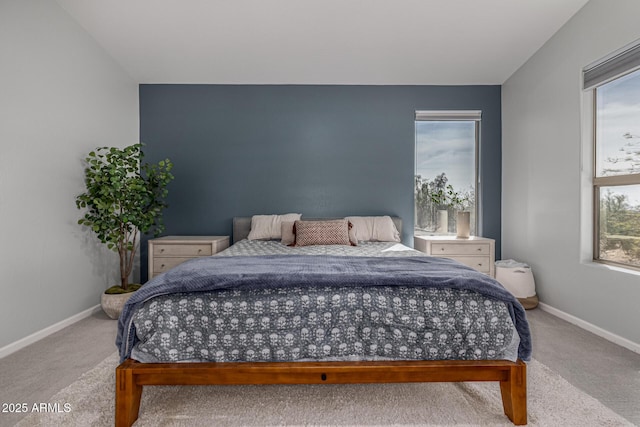bedroom with baseboards and carpet floors