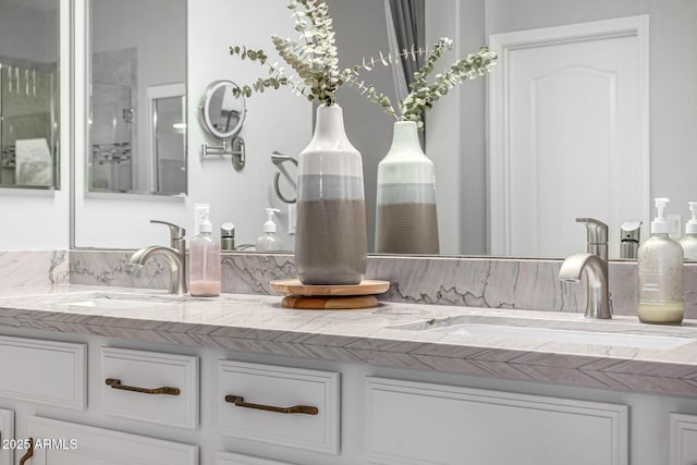 bathroom with double vanity and a sink