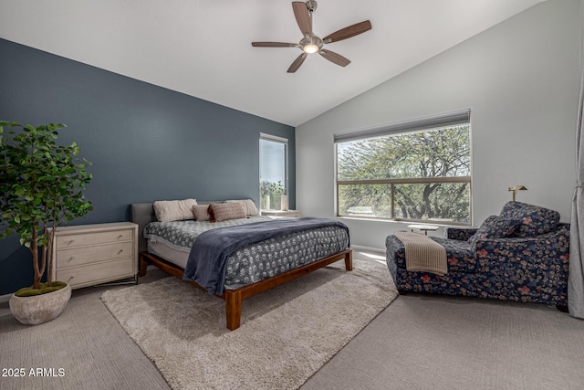 carpeted bedroom featuring ceiling fan and lofted ceiling