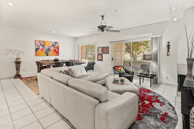 living room featuring light tile patterned flooring, recessed lighting, and a ceiling fan