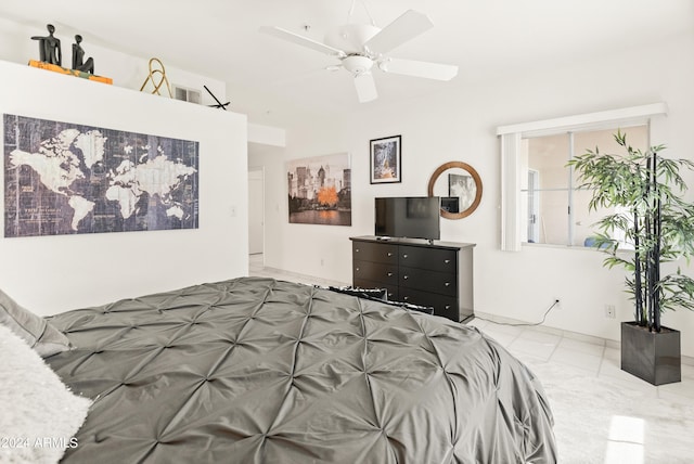 tiled bedroom with visible vents and a ceiling fan