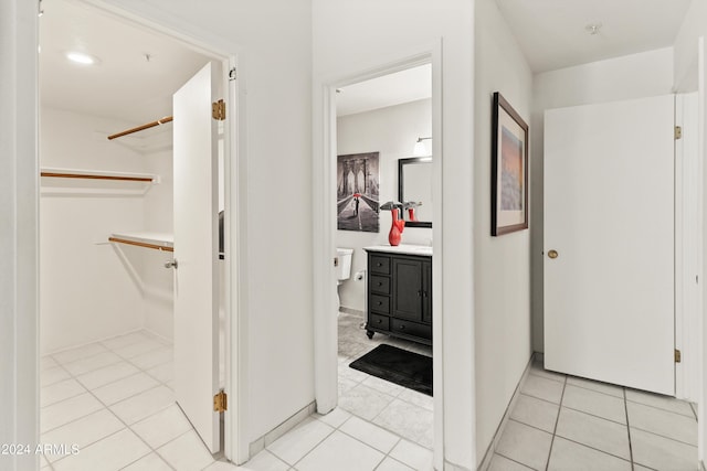 hallway with light tile patterned floors