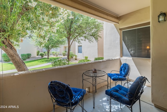 view of patio featuring a balcony