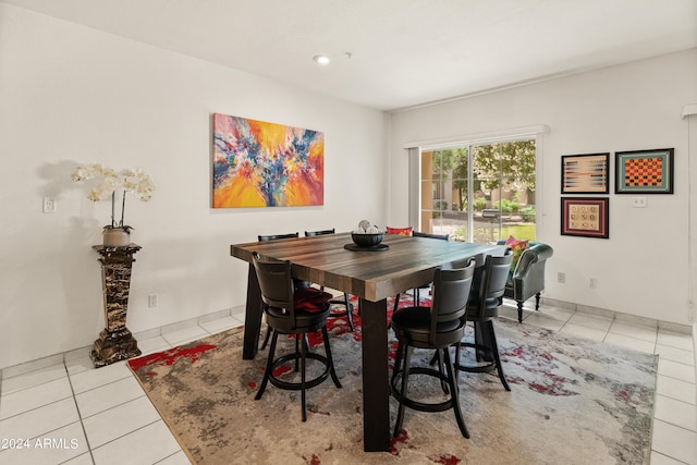 dining area with light tile patterned flooring