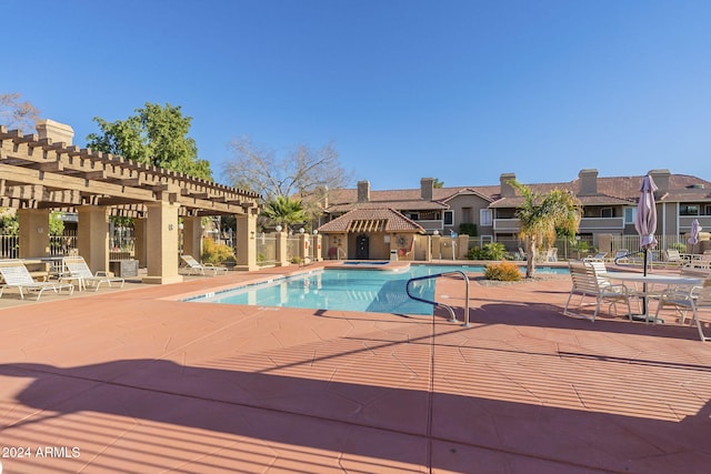 view of swimming pool featuring a pergola and a patio area