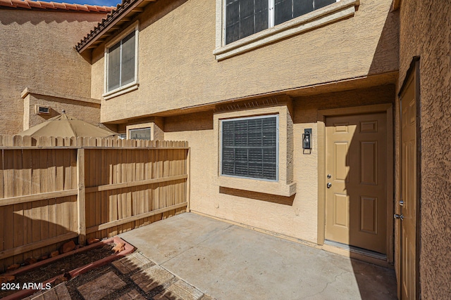 property entrance with a patio