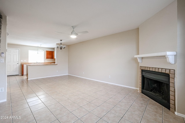 unfurnished living room with light tile patterned floors and ceiling fan